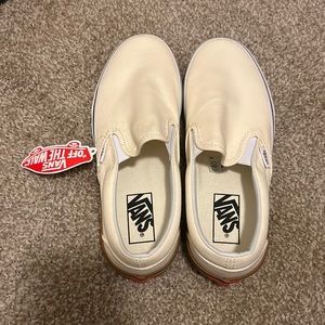 Light yellow/beige vans. Never worn. Size 7